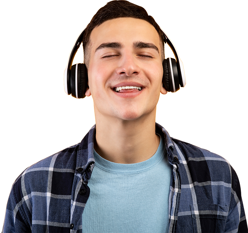 handsome young man wearing headphones listening to 7JLYT6E